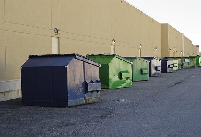 a pack of different construction bins lined up for service in Bluff City